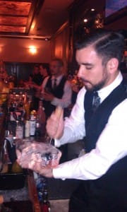Tom McGuire carves ice into cubes by hand at Prohibition in Atlanta, Georgia