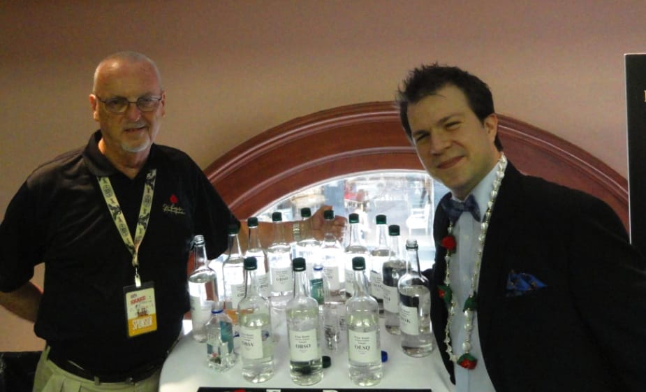 Four Roses Master Distiller Jim Rutledge and BourbonBlog.com's Tom Fischer next to the 10 Unique Recipes of Four Roses in their "White Dog" un-aged form to sample