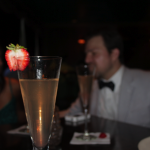 Strawberry garnish on the elegant Pisco Porton Champagne Cocktail at the Bombay Club, New Orleans