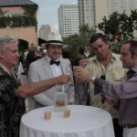 King Cocktail Dale DeGroff, BourbonBlog.com's Tom Fischer and Pisco Porton's Master Distiler John Schuler and CEO Jean-Francois Bonneté at Tales of the Cocktail toasting atop Hotel Monteleone Poolside