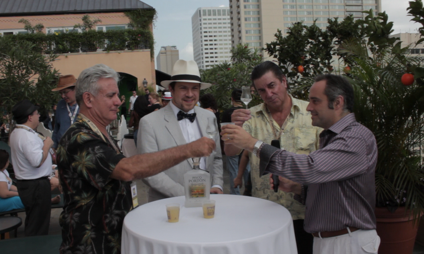 King Cocktail Dale DeGroff, BourbonBlog.com's Tom Fischer and Pisco Porton's Master Distiler John Schuler and CEO Jean-Francois Bonneté at Tales of the Cocktail toasting atop Hotel Monteleone Poolside