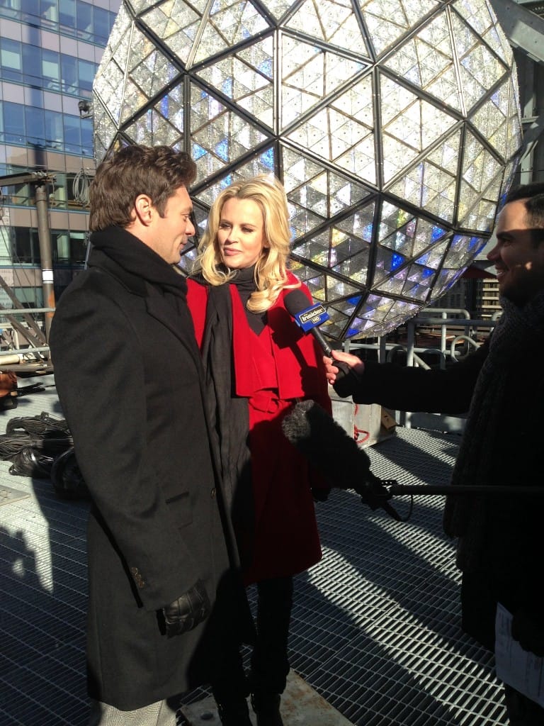 Host Ryan Seacrest and Jenny McCarthy talk in front of the Times Square Ball made of Waterford Crystals 