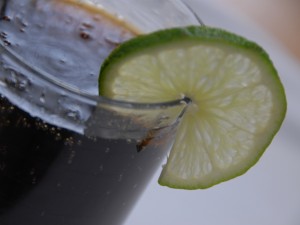 Rum and coke with twist of lime