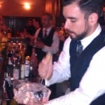 Tom McGuire carves ice into cubes by hand at Prohibition in Atlanta, Georgia