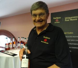 Four Roses_Brand Ambassador Al Young holds a bottle OBSK, one of the Ten Unique Recipes of Four Roses Bourbon, all ten were sampled for the first time ever at Tales of the Cocktail 2011