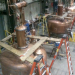 These copper pot stills are captured as they are getting ready for their trip to Stranahan’s Distillery