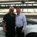 Guy Fieri as he finishes his practice run with 3 time Indy 500 champ, Johnny Rutherford