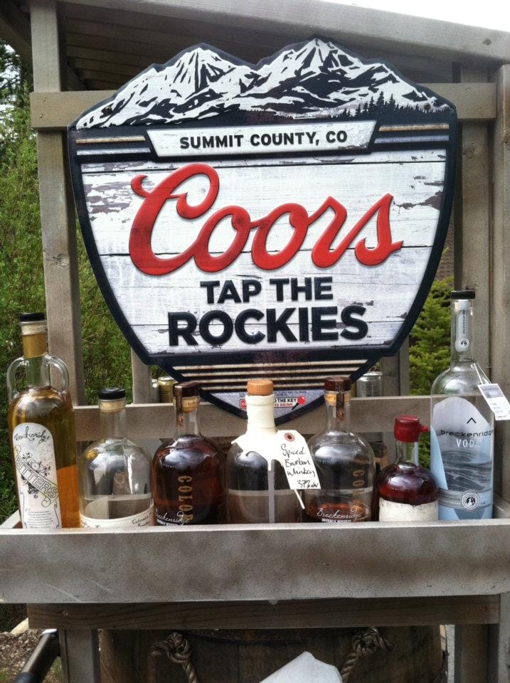 Breckenridge Distillery's outhouse racer was built with it's own branded bar featuring Breckenridge spirits and a Coors Beer sign