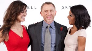 James Bond (Daniel Craig) with new Bond Girls ( Bérénice Marlohe is at left; Naomie Harris, a.k.a. Miss Moneypenny, at right)