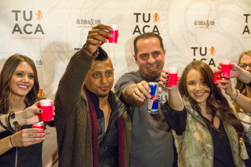 DJ Ravindrums and Corey Miller toast with TUACA at Drinks & Ink in Denver,Colorado 