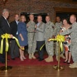 Maj. Gen. Jeff Smith, commander of U.S. Cadet Command and Ft. Knox, cuts the ceremonial ribbon with Joe Bollinger, director of military and transportation for Brown-Forman, to commenorate the grand opening of the Woodford Reserve Room at the Saber and Quill Club on May 15 at Ft. Knox.